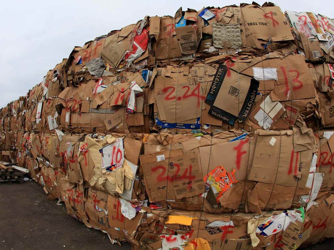 Stacked bales of baled cardboard waiting for collection